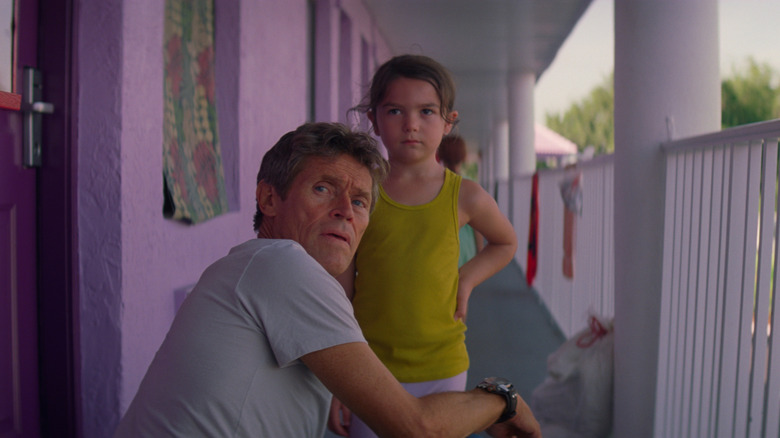 Willem Dafoe as Bobby watches over Brooklynn Kimberly Prince as Moonee in The Florida Project