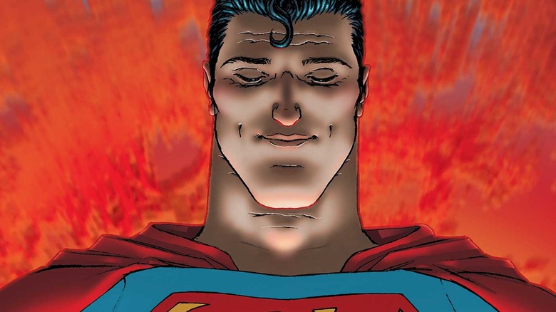 All-Star Superman holds a globe