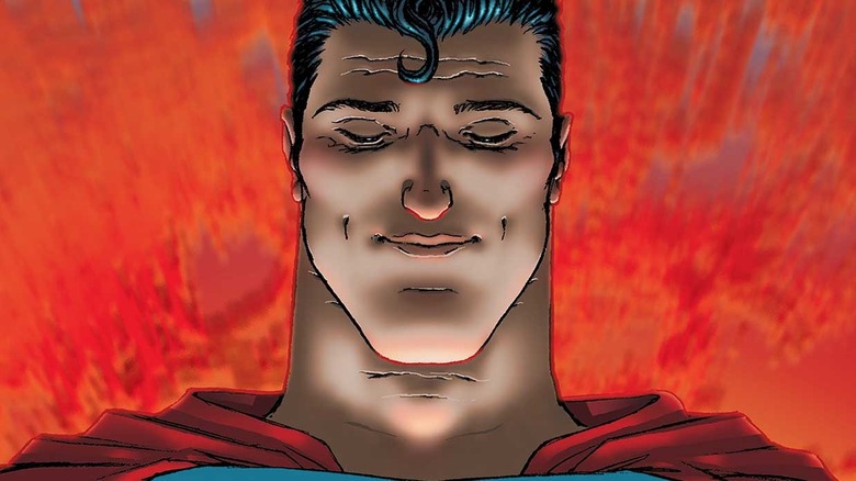 All-Star Superman holds a globe