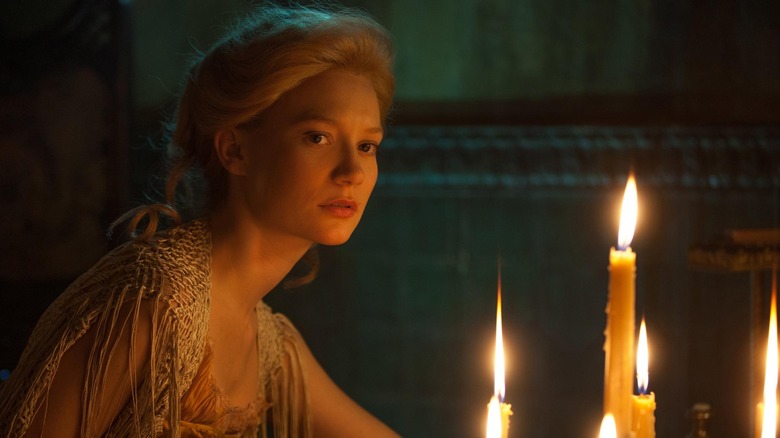 gothic woman with candelabra in Crimson Peak