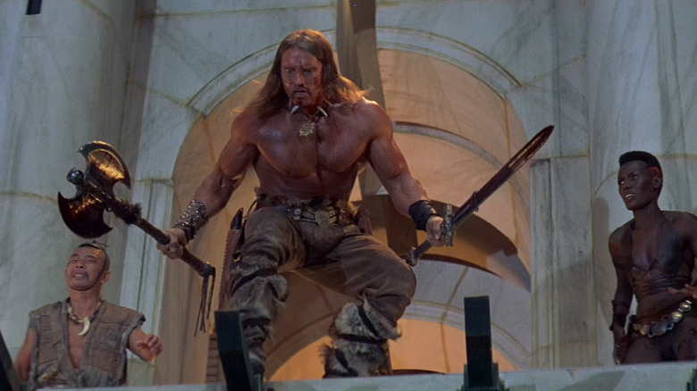 Arnold Schwarzenegger as Conan the Destroyer prepares to jump into battle