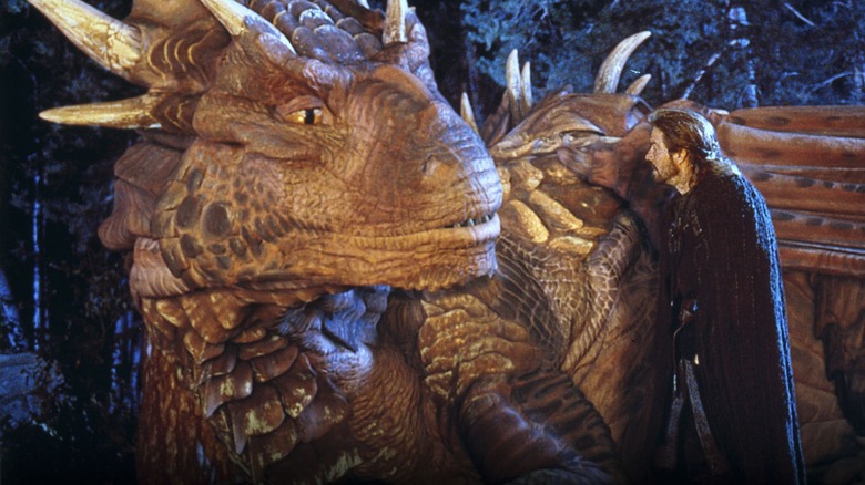 Draco and Sir Bowen (Dennis Quaid) stop in the night to talk.