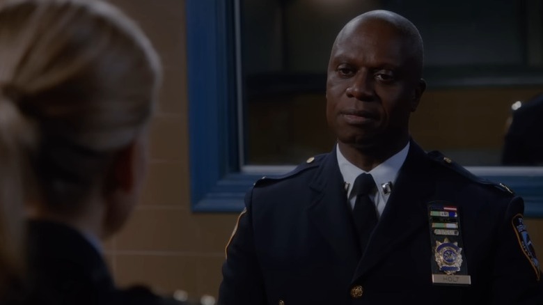 Andre Braugher as Captain Raymond Holt smiling serenely in an interrogation room on Brooklyn Nine-Nine