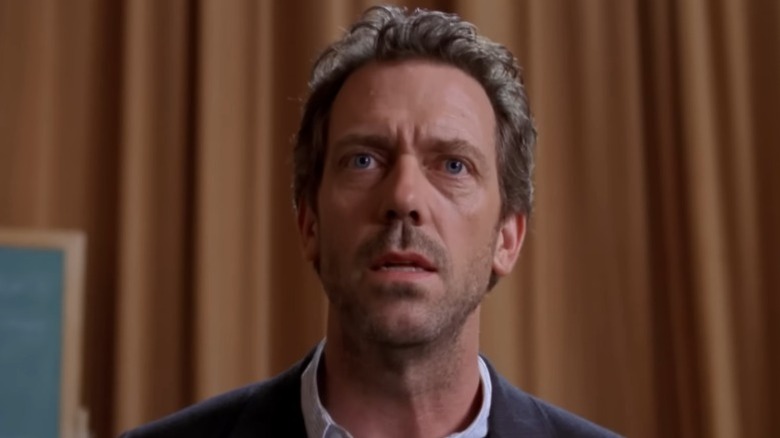 Hugh Laurie as Dr. Gregory House speaking sternly on House