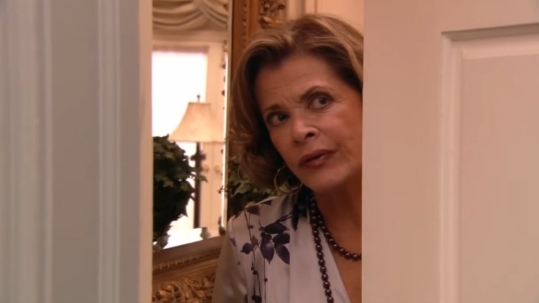 Jessica Walter as Lucille Bluth closing a door while glaring suspiciously on The Leftovers