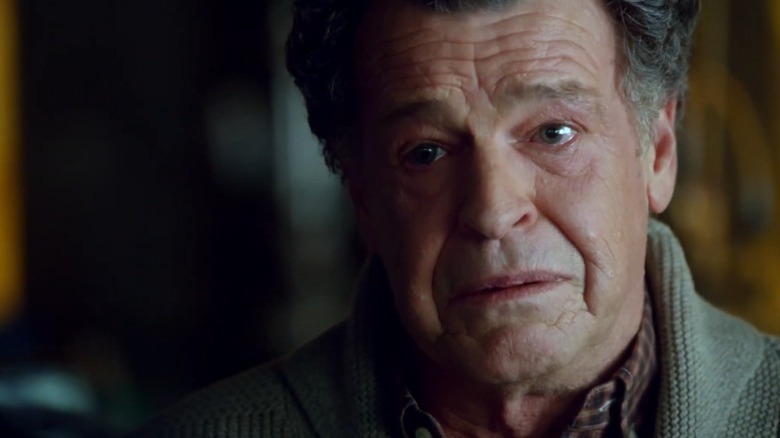 John Noble as Dr. Walter Bishop talking while misty-eyed on Fringe