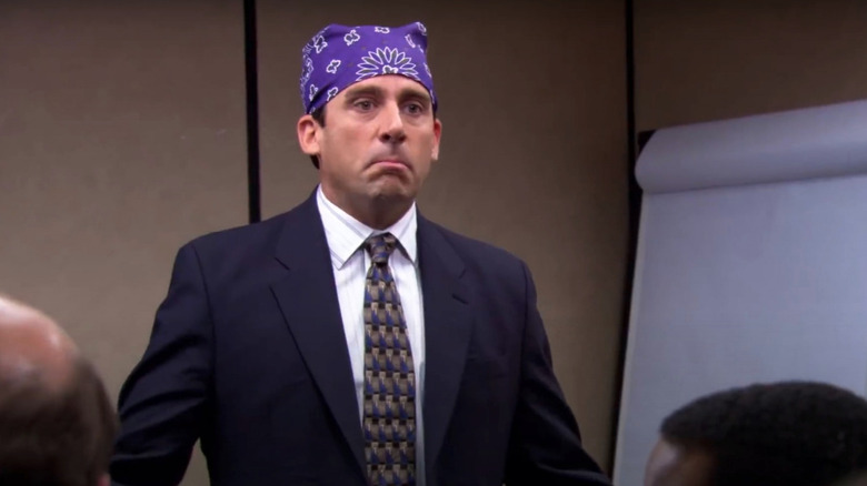 Steve Carell as Michael Scott wearing a purple bandana as Prison Mike in The Office