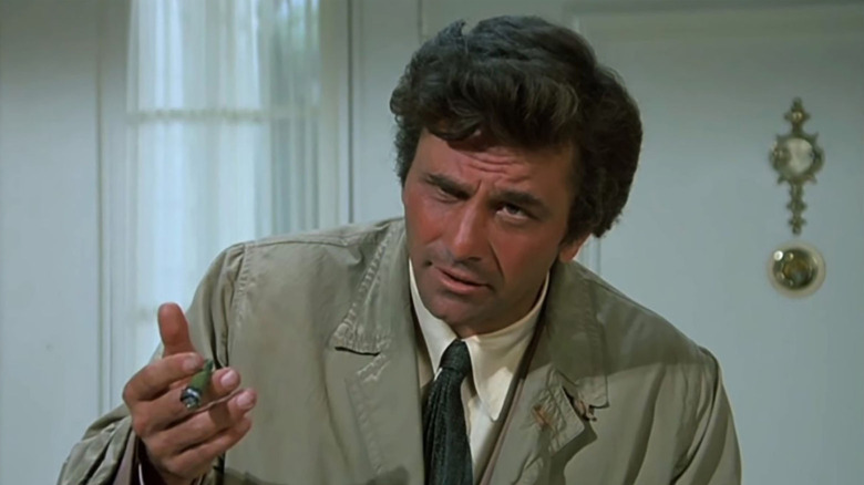 Columbo (Peter Falk) questions someone in Columbo