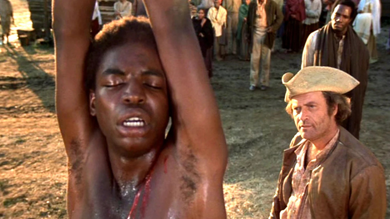 Kunta Kinte (LeVar Burton) is whipped by Ames (Vic Morrow) in Roots
