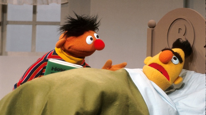 Ernie bothers Bert while he's laying in bed in Sesame Street