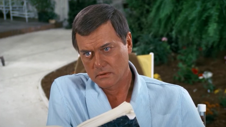 Larry Hagman's J.R. Ewing is surprised by a visitor on a special episode of Dallas