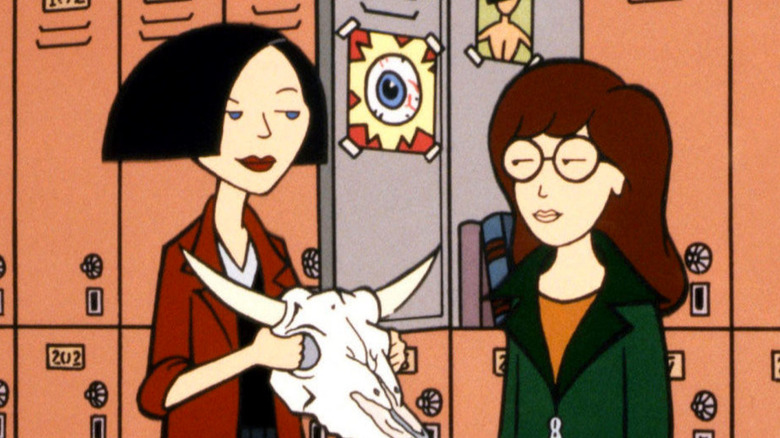 Jane Lane gives a sly smile to Daria Morgendorffer in front of school lockers on Daria.