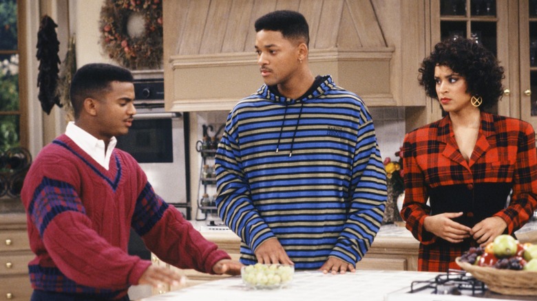 Alfonso Ribiero as Carlton Banks talks to Will Smith as Will Smith and Karyn PArsons as Hilary Banks in the kitchen in Fresh Prince of Bel-Air