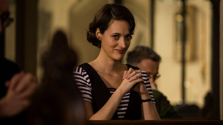 Phoebe Waller-Bridge as Fleabag smiling in church in Fleabag