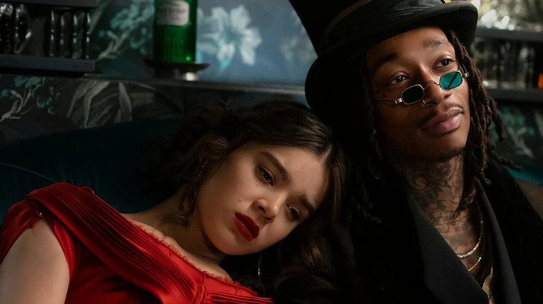 Emily Dickinson (Hailee Steinfeld) leaning against Death (Wiz Khalifa) on Dickinson