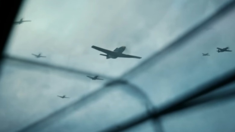 Bomber planes flying in the sky in The Shadow in My Eye