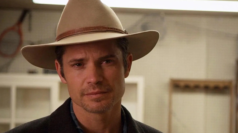 Raylan Givens (Timothy Olyphant) tilts his head quizzically in Justified