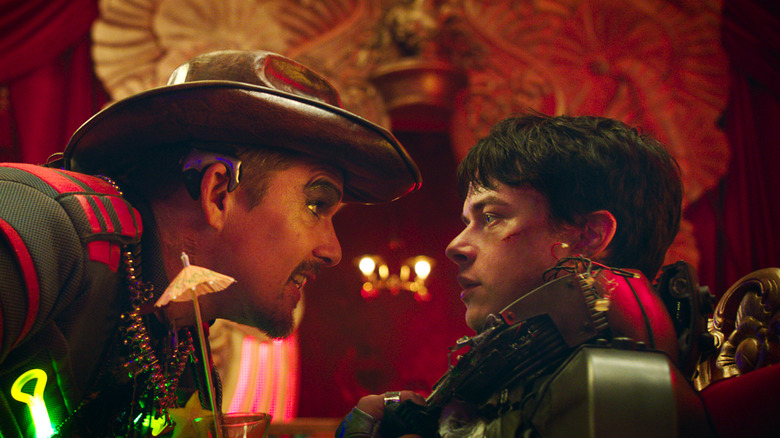 Ethan Hawke and Dane DeHaan glaring at each other