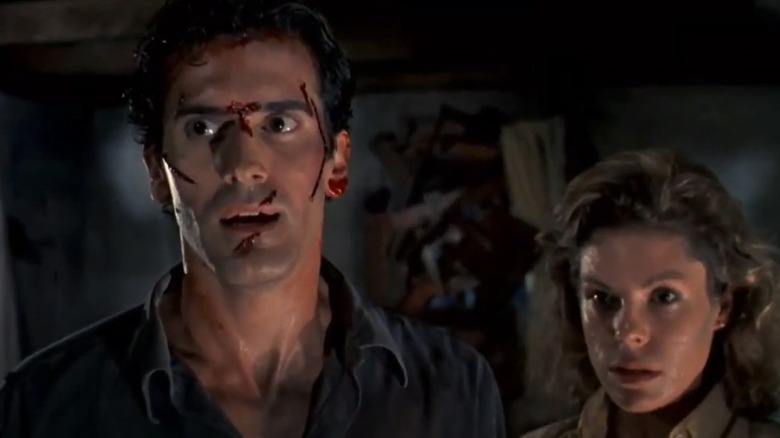 Bruce Campbell and Sarah Berry in "Evil Dead II" 