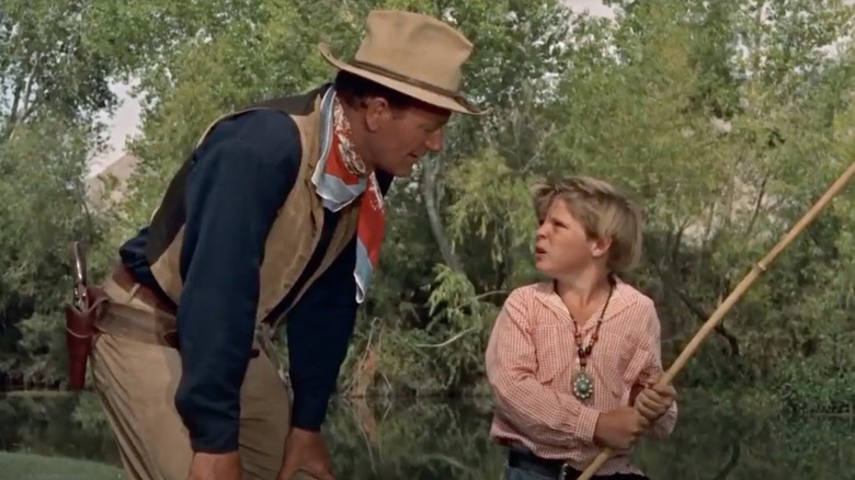 Hondo talks to a boy