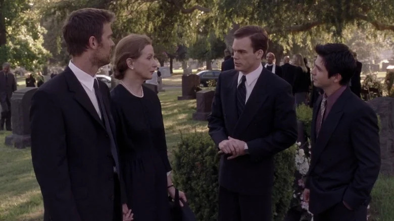 Peter Krause as Nate, Frances Conroy as Ruth, Michael C. Hall as David, and Freddy Rodriguez as Federico wearing black at funeral in Six Feet Under