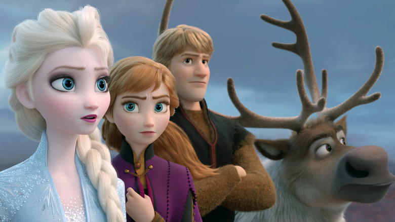 Elsa (Idina Menzel) looks at the horizon with Anna (Kristen Bell) and Kristoff (Jonathan Groff) in Frozen 2