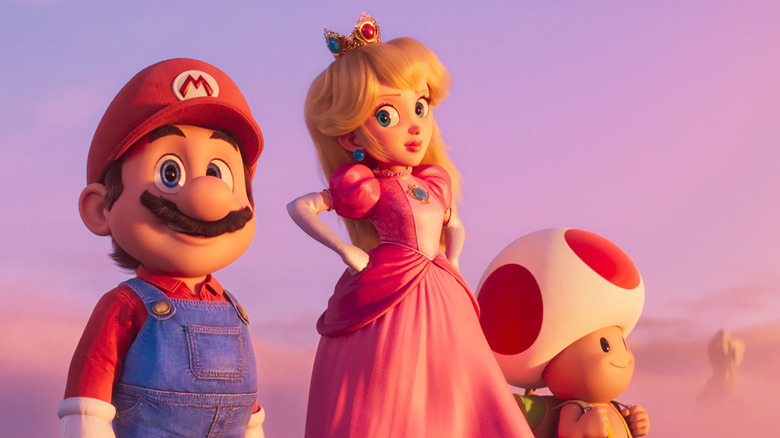 Mario (Chris Pratt), Peach (Anya Taylor-Joy), and Toad (Keegan-Michael Key) look out over the Mushroom Kingdom in The Super Mario Bros. Movie