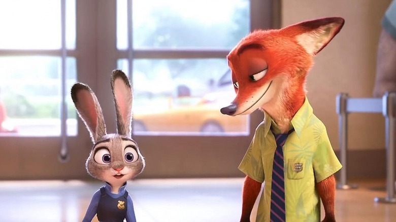 Nick Wilde (Jason Bateman) smiles looking down at an astonished Judy Hopps (Ginnifer Goodwin) in Zootopia