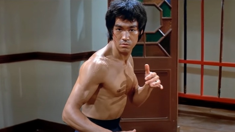 Bruce Lee sitting