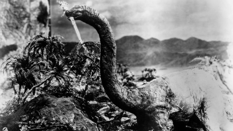 Long neck dinosaur eating at a tree