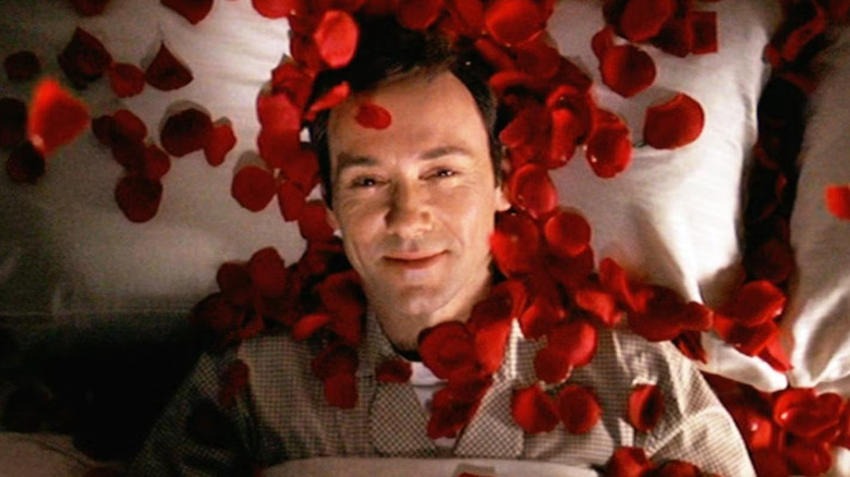 Lester Burnham (Kevin Spacey) fantasizes with rose petals in American Beauty