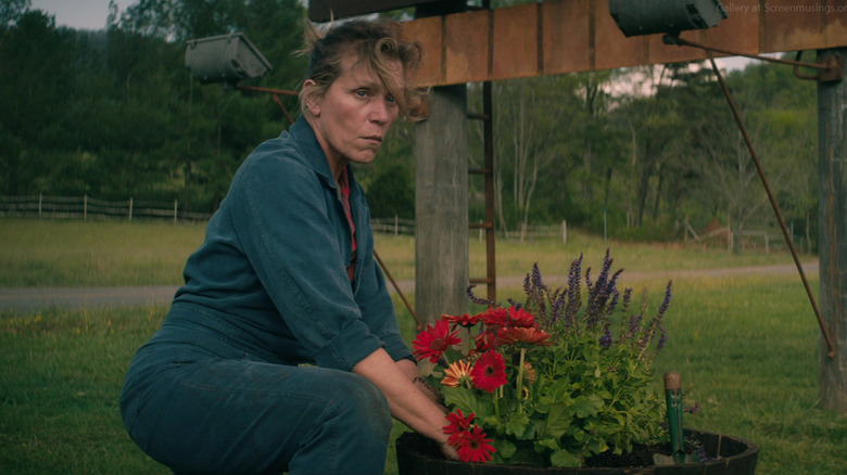 Mildred Hayes (Frances McDormand) tends to flowers in Three Billboards Outside Ebbing, Missouri