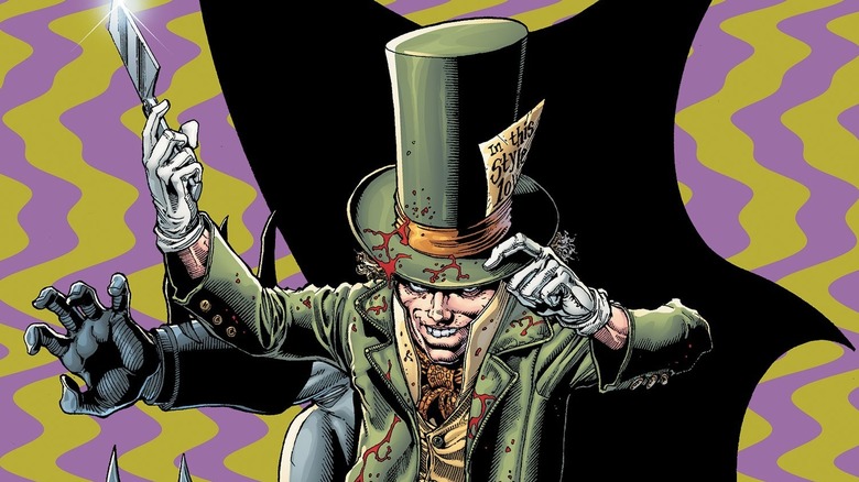 Mad Hatter touching his bloody hat and holding a knife