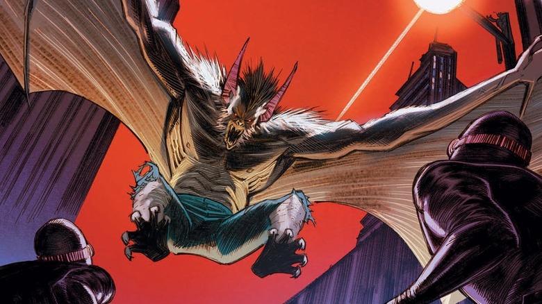 A growling Man-Bat flying downward toward two people