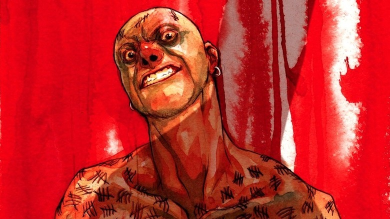 Victor Zsasz grinning at the Batman