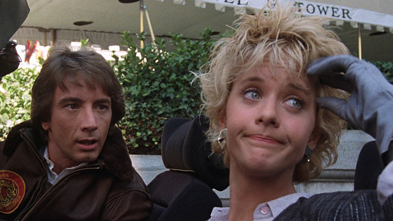 Jack Putter (Martin Short) sits in a car with an incredulous Lydia Maxwell (Meg Ryan) in Innerspace