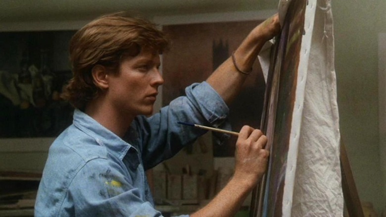 Keith Nelson (Eric Stoltz) paints intensely on a canvas in Some Kind of Wonderful