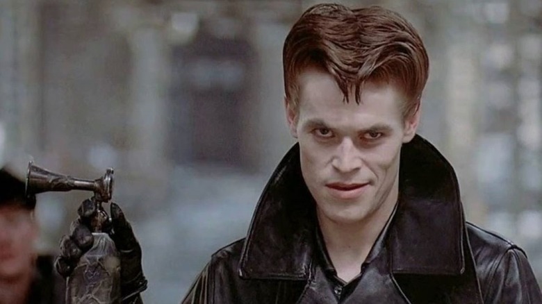 Raven Shaddock (Willem Dafoe) smirks while holding an air horn in Streets of Fire