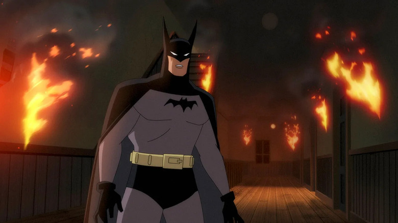 Batman (Hamish Linklater) navigates a burning building in Batman: Caped Crusader