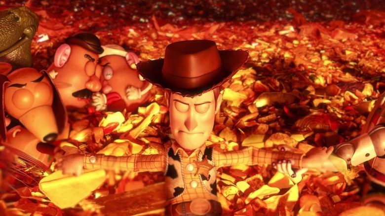 Woody holding hands with his friends in Toy Story 3