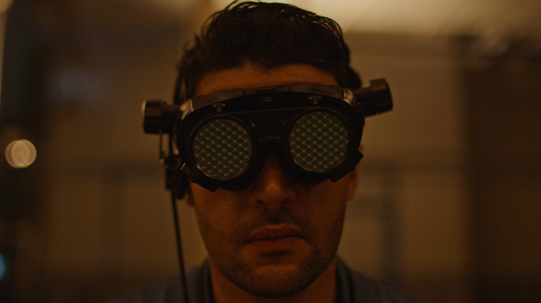Christopher Abbott wears goggles