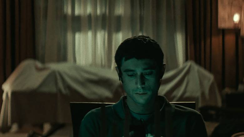 Dave Davis sits with dead body