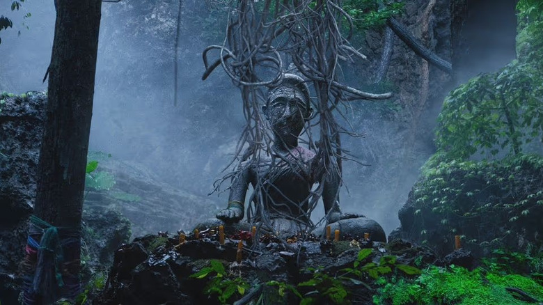 A statue in the woods in The Medium