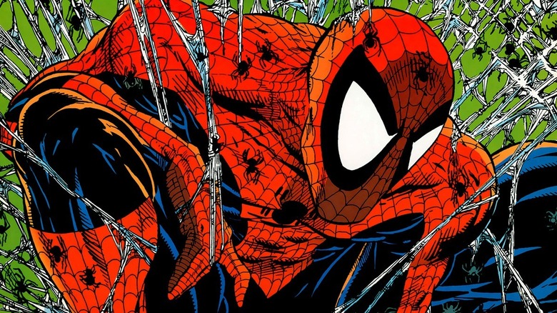 Spider-Man stuck in the web with spiders crawling all over him