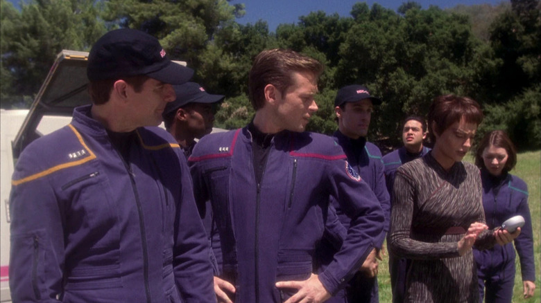 Jonathan Archer (Scott Bakula) and Trip Tucker (Connor Trinneer) watch T'Pol (Jolene Blalock) take scanner readings in Star Trek: Enterprise