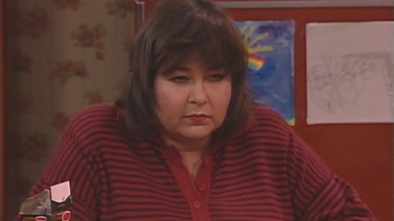 Roseanne Barr as Roseanne Conner scowling in Roseanne