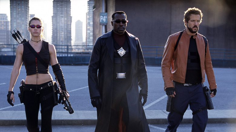 Wesley Snipes as Blade walks with Jessica Biel as Abigail and Ryan Reynolds as Hannibal in Blade Trinity