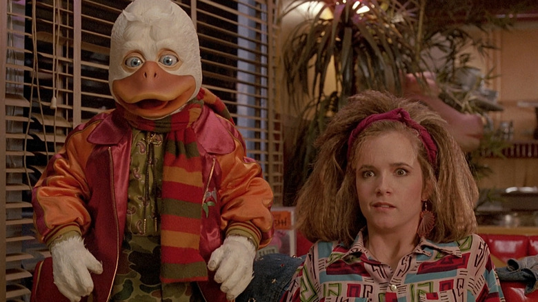 Ed Gale as Howard the Duck and Lea Thompson as Beverly Switzler look shocked in Howard the Duck