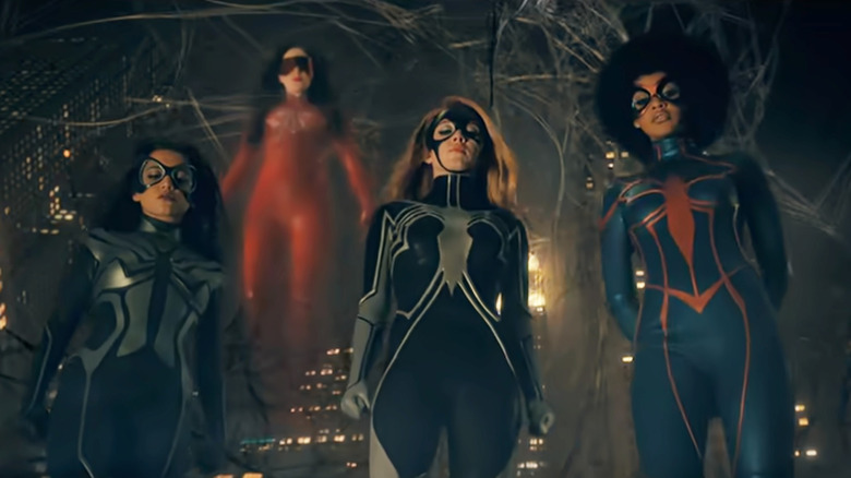 Isabela Merced as Anya, Dakota Johnson as Cassandra Webb, Sydney Sweeney as Julia, and Celeste O'Connor as Mattie in their superhero suits in Madame Web