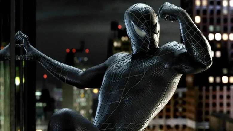 Tobey Maguire as Spider-Man looks at his black suit in Spider-Man 3